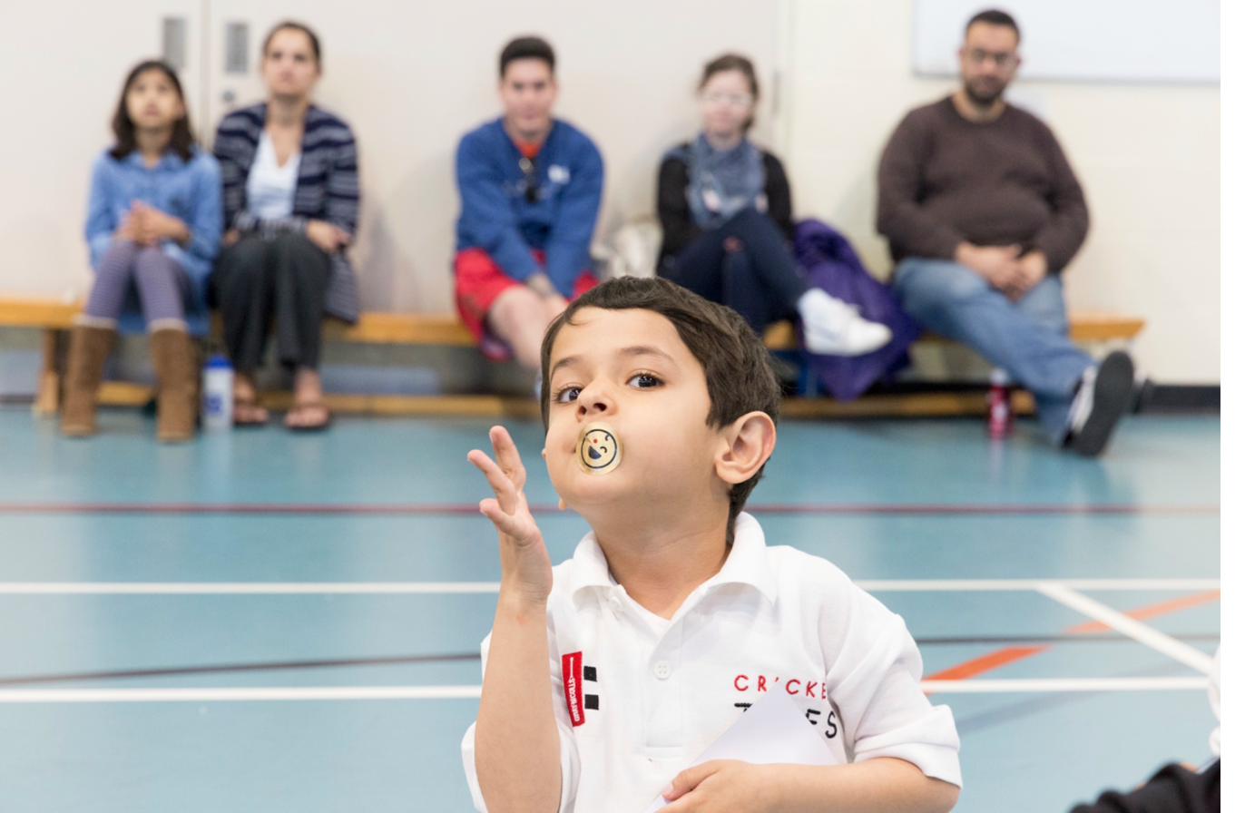 Child catching during a Cricket Tikes session